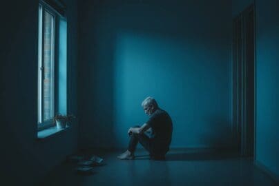 lonely man sitting alone