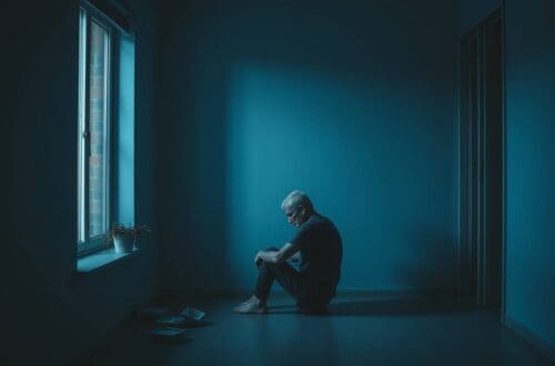 lonely man sitting alone