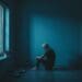 lonely man sitting alone